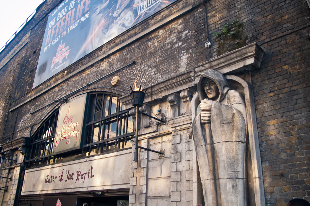 “The London Dungeon seen from outside with a statue of a man”