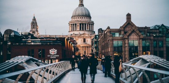 People-passing-from-the-Millenium-Bridge-and-St.-Pauls-Cathedral-seen-on-the-back